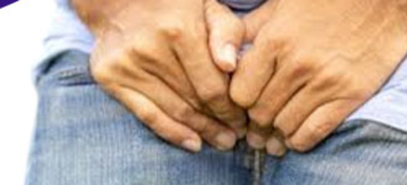 Man experiencing discomfort from prostate symptoms